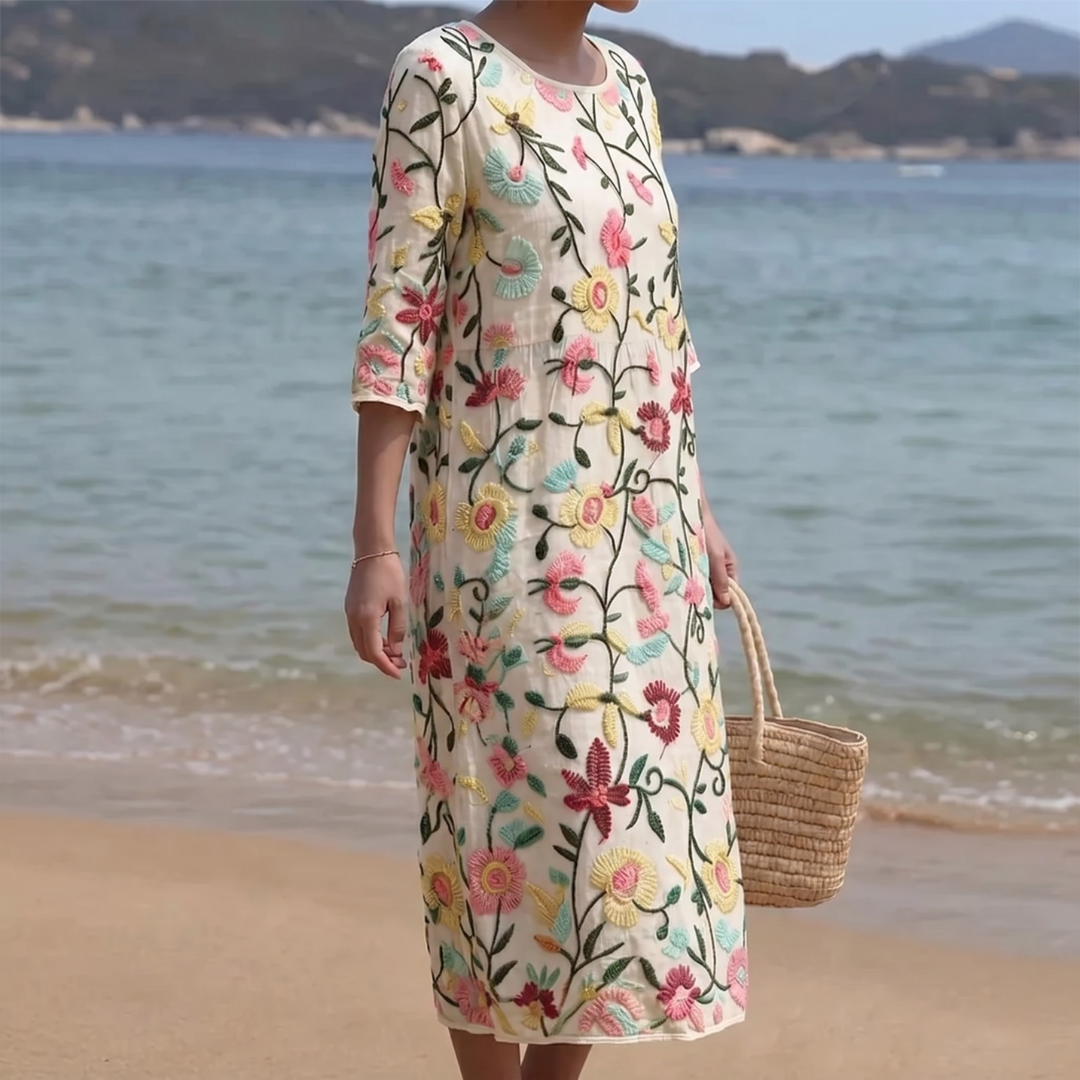 Vestido midi bordado floral para mujer, estilo femenino y elegante. Perfecto para el verano y ocasiones especiales.
