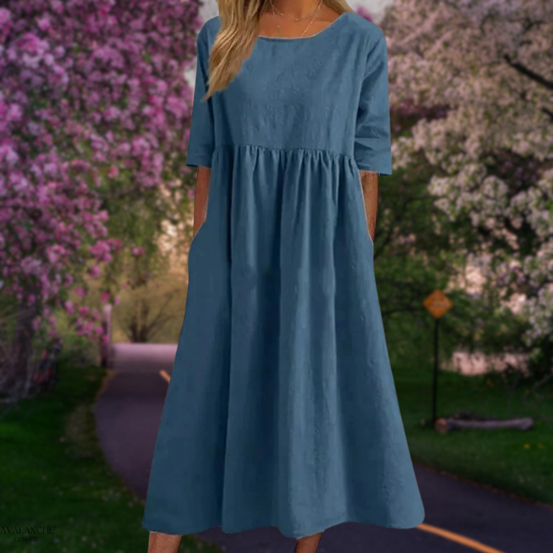 Vestido midi holgado de poliéster ligero con mangas medias, perfecto para el verano de la mujer.