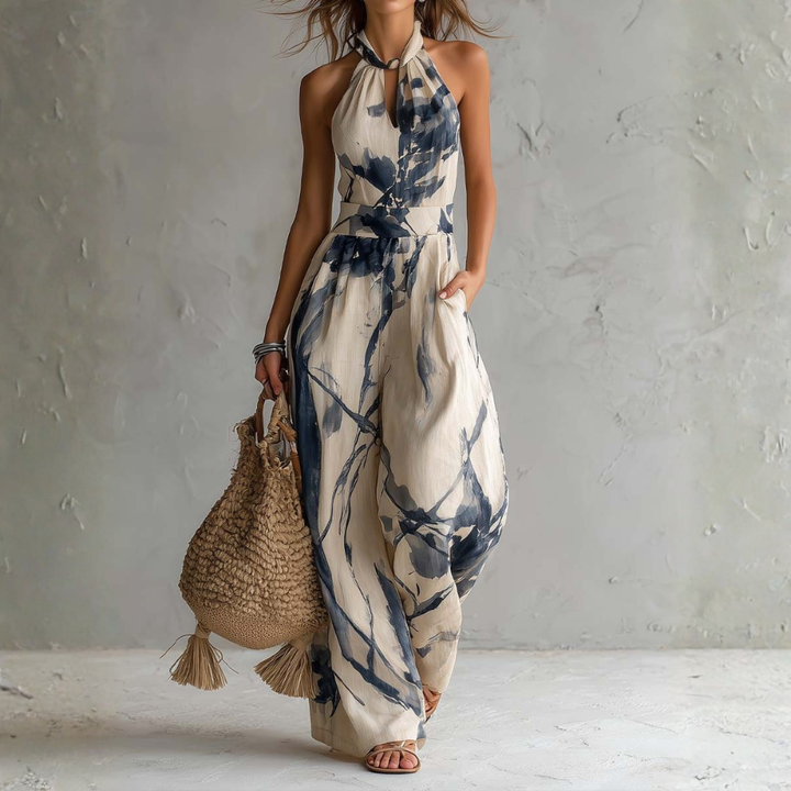 Mono halter cómodo y elegante para mujer. Estampado artístico beige, piernas anchas. Perfecto para eventos de verano.