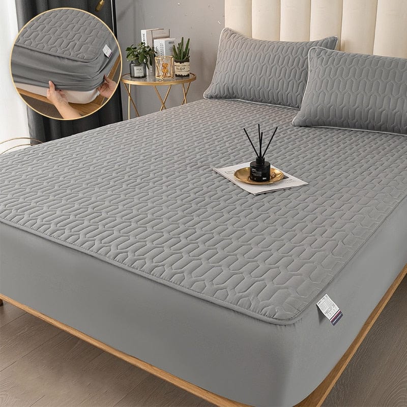 Protector de colchón impermeable y acolchado, esencial para la higiene y el confort de tu dormitorio.