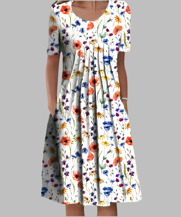 Vestido largo fluido de mujer con escote V y estampado floral vibrante. Ideal para primavera y verano.