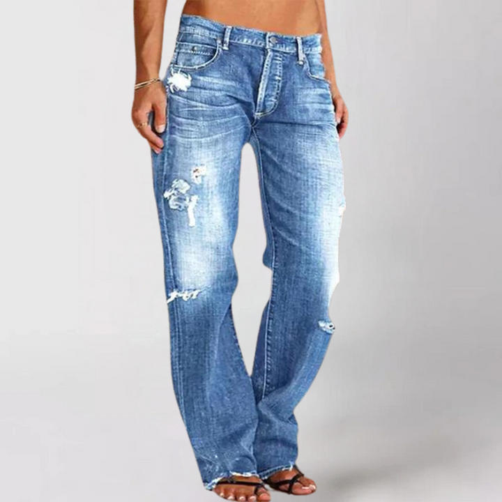 Jeans de mujer talle bajo, pierna ancha. Vaqueros relajados en denim azul, perfectos para un look casual y cómodo.