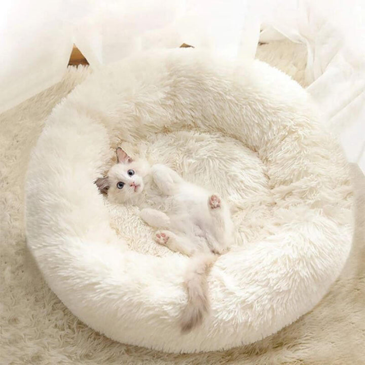 Cama antiestrés para gatos, cojín mullido que ofrece confort y seguridad. Accesorio esencial para el hogar de tu mascota.