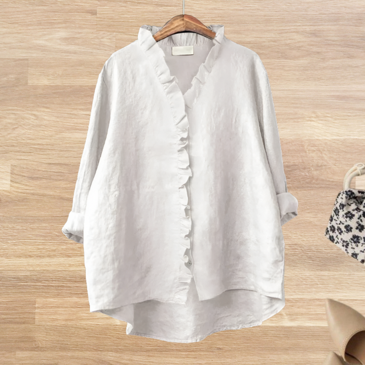 Blusa fluida de mujer con volantes, manga larga, estilo elegante y casual. Ropa femenina chic y cómoda.