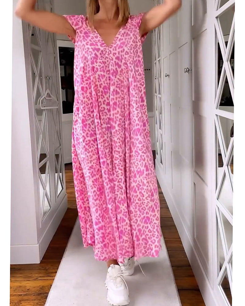 Vestido bohemio de playa para mujer, estampado vibrante, escote V. Moda de verano casual y elegante.