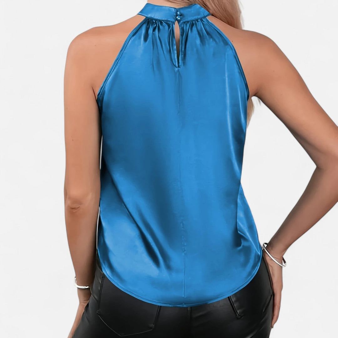 Blusa de mujer estilo sofisticado, cuello halter, ideal para atuendos de fiesta o casuales.