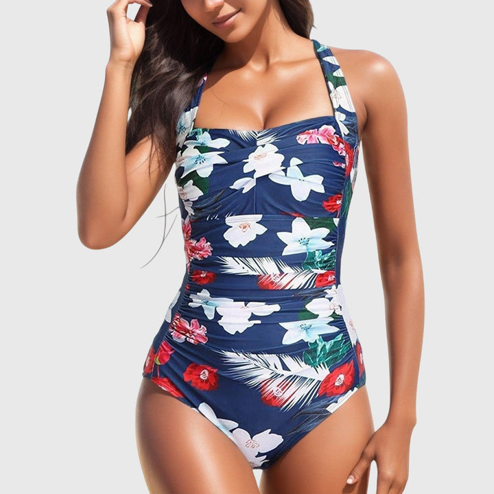 Bañador de verano mujer, una pieza con vibrante estampado tropical, fruncido y escote halter.