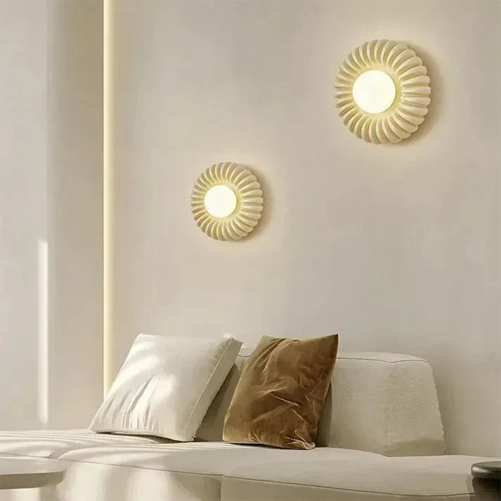 Iluminación LED de pared redonda, ideal para decorar dormitorio moderno.