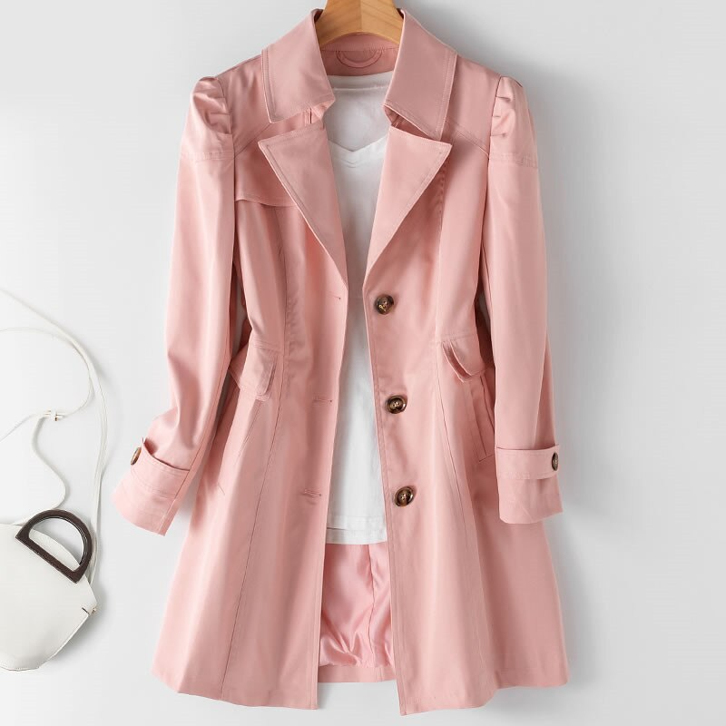Gabardina de moda para mujer, estilo clásico. Presenta hombros acolchados y un único botón para un look chic.