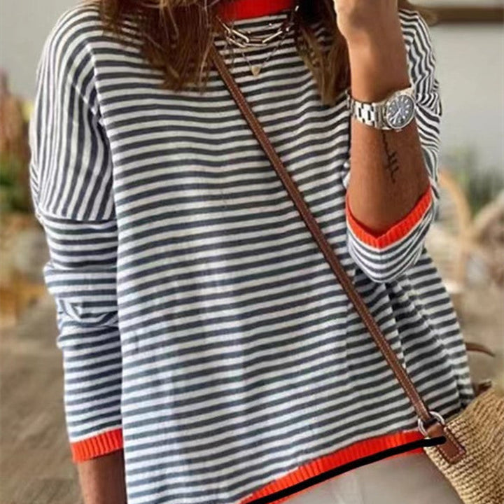 Suéter de rayas para mujer con hombros caídos y bloques de color. Ideal para moda casual de otoño-invierno.