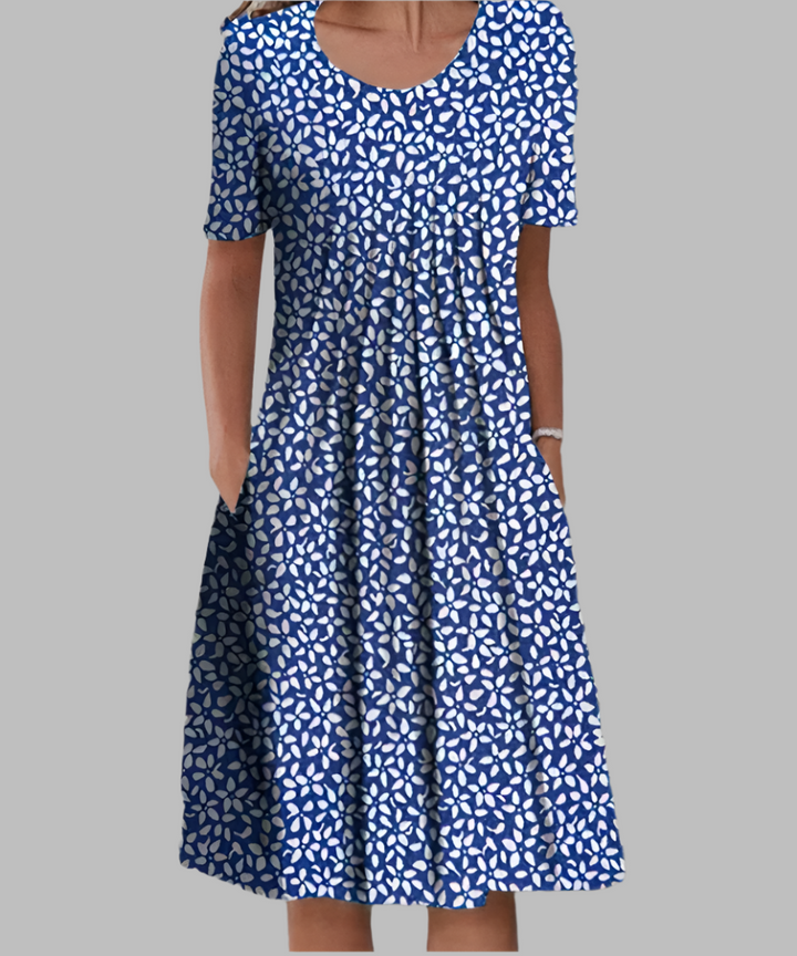 Vestido floral largo de mujer, con escote V profundo y tela fluida y fresca. Ideal para eventos de verano.