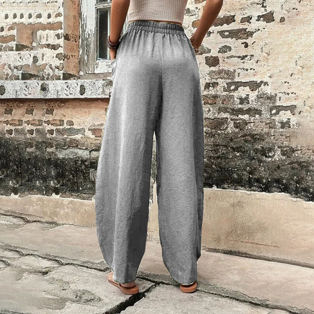 Pantalones de mujer fluidos, pierna ancha, estilo casual elegante, cintura elástica, ideales primavera.