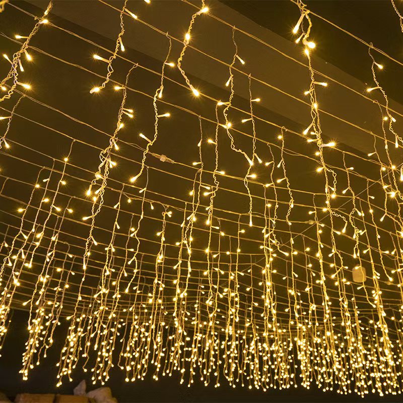 Luces LED carámbano exterior 50m, blanco cálido. Decoración navideña impermeable para jardín y terraza.