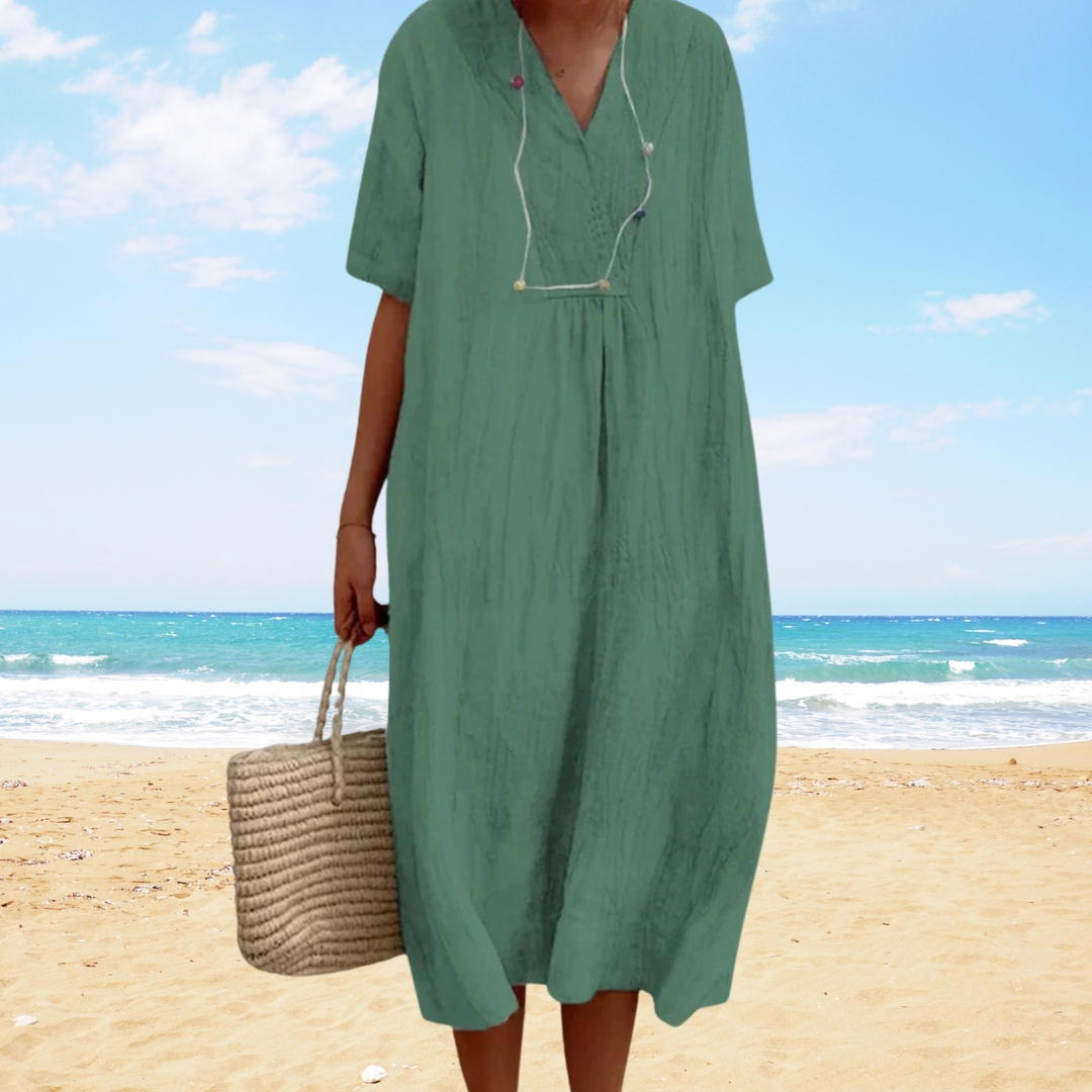 Vestido sin mangas de verano para mujer, corte midi y fluido con escote en V, perfecto para un look casual.