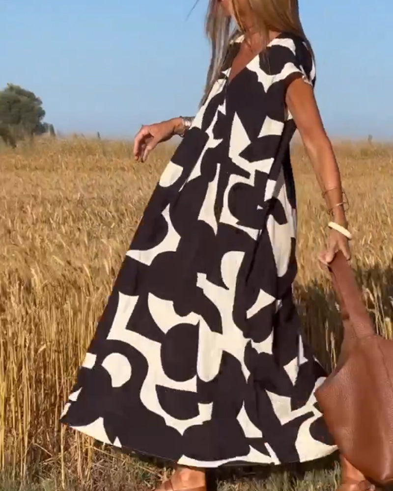 Vestido casual estampado para mujer, estilo fluido con escote V y manga corta cómoda.