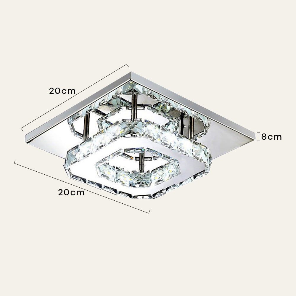 Detalle de lámpara de techo LED de cristal, mostrando su moderno diseño y brillo decorativo.
