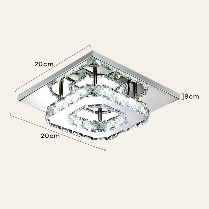 Detalle de lámpara de techo LED de cristal, mostrando su moderno diseño y brillo decorativo.