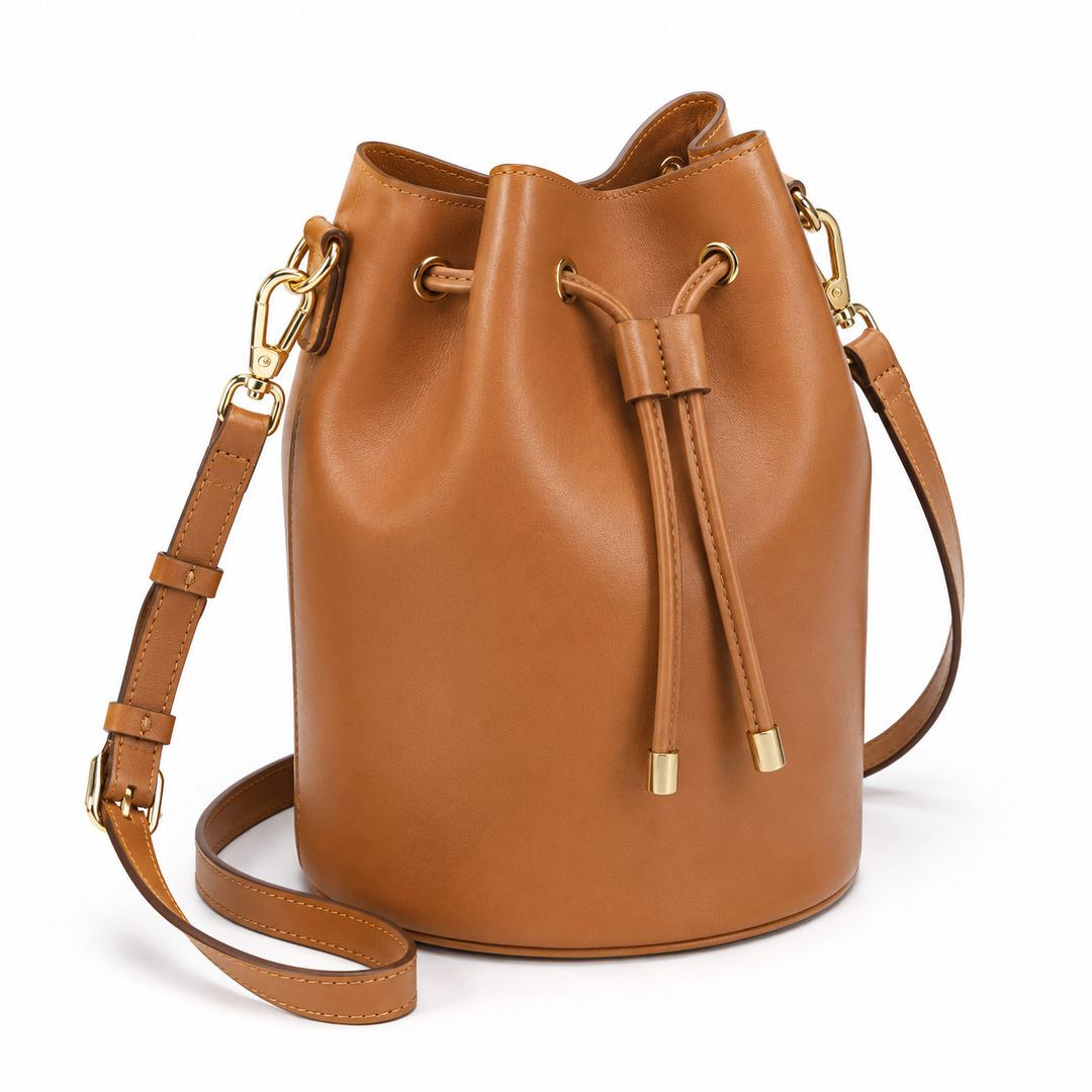 Bolso de cuero tipo cubo para mujer, elegante y moderno, accesorio versátil para la moda.