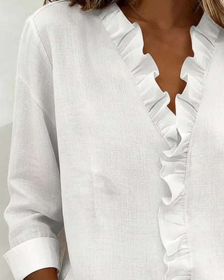 Blusa de primavera para mujer, con volantes, escote en V y mangas largas estilo casual y fresco.