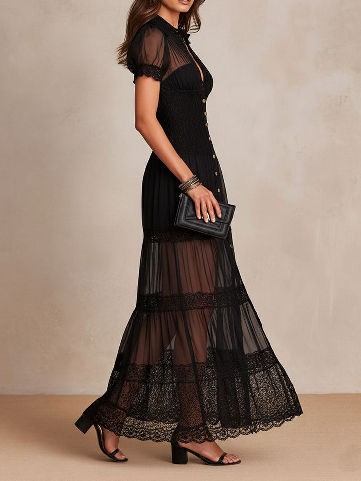 Silueta del vestido maxi negro de noche, destacando la falda fluida y detalles de encaje en la parte superior.