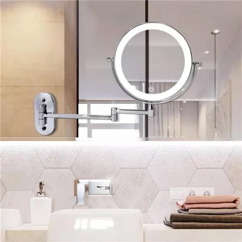 Espejo de maquillaje LED magnificador de pared con brazo articulado, ideal para vanidad en el baño.