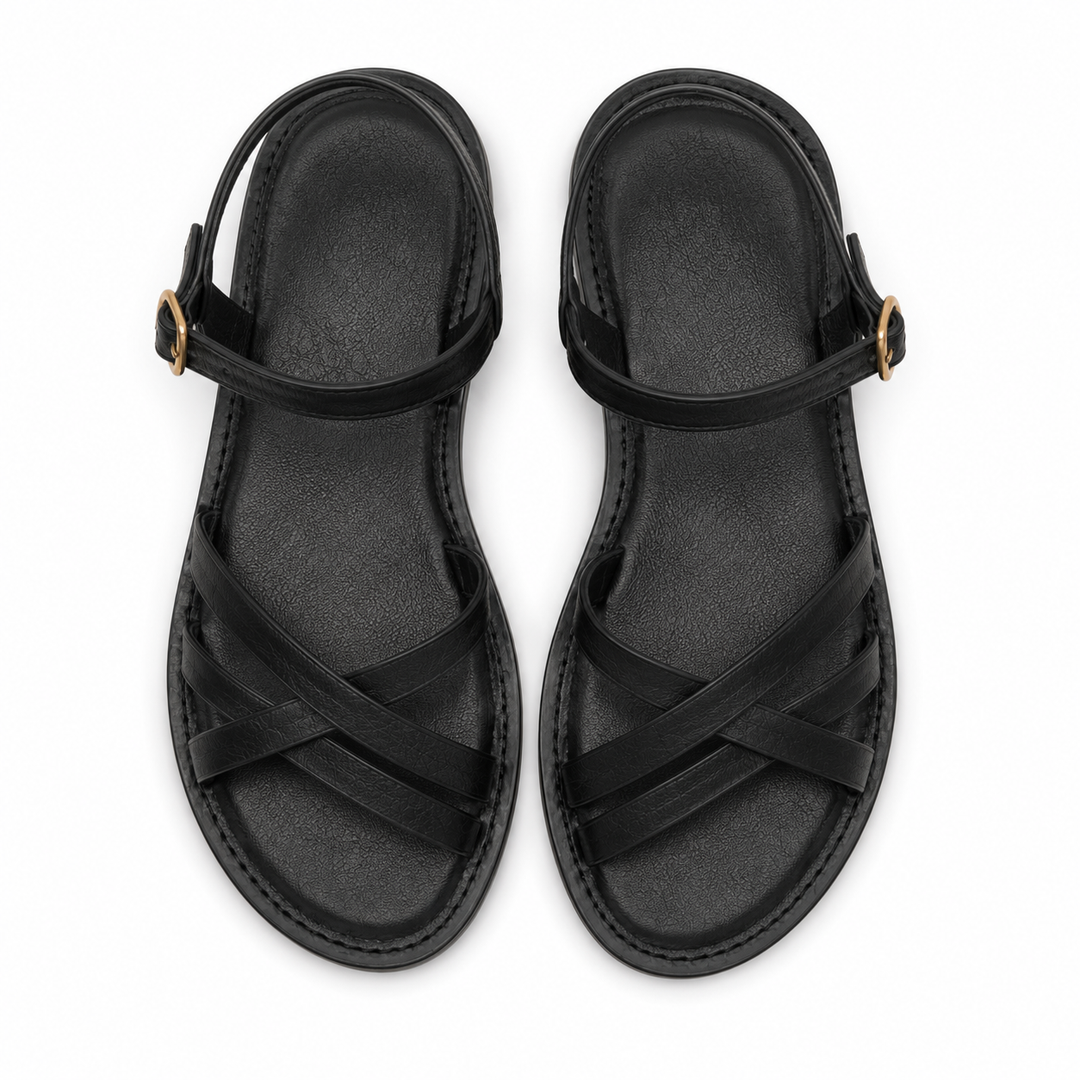Moda mujer: sandalias negras con detalle de tiras cruzadas, un calzado cómodo y estiloso para el verano.