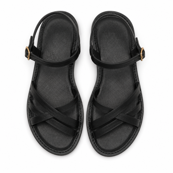 Moda mujer: sandalias negras con detalle de tiras cruzadas, un calzado cómodo y estiloso para el verano.