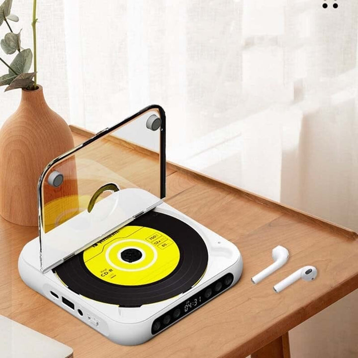 Compacto reproductor de CD portátil con Bluetooth, batería y sonido Hi-Fi, perfecto para viajes.