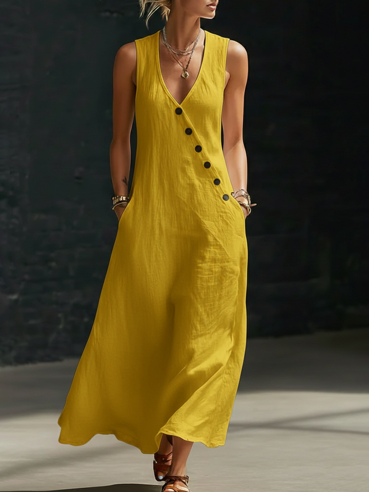 Mujer luciendo vestido maxi fluido con botones. Estilo cómodo y elegante, perfecto para el verano.