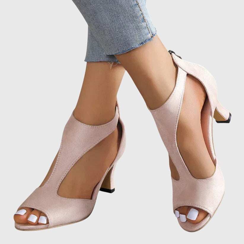 Tacones ortopédicos elegantes negros para mujer, con soporte ergonómico para comodidad duradera.