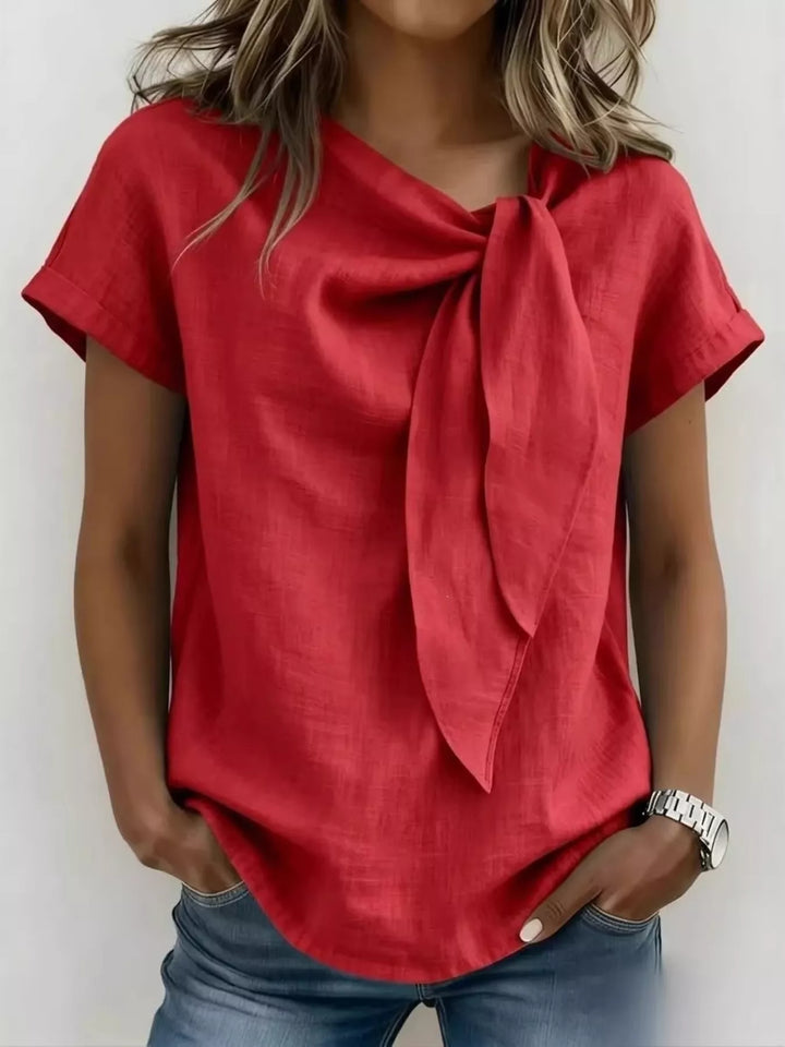 Blusa moderna de manga corta para mujer, tallas grandes, con lazo en el cuello. Tendencia femenina para un verano casual.
