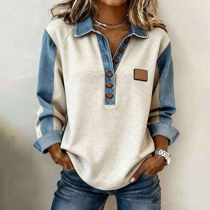 Top sudadera azul para mujer con cuello solapa, estilo vintage. Prenda casual cómoda, ideal para moda otoño.