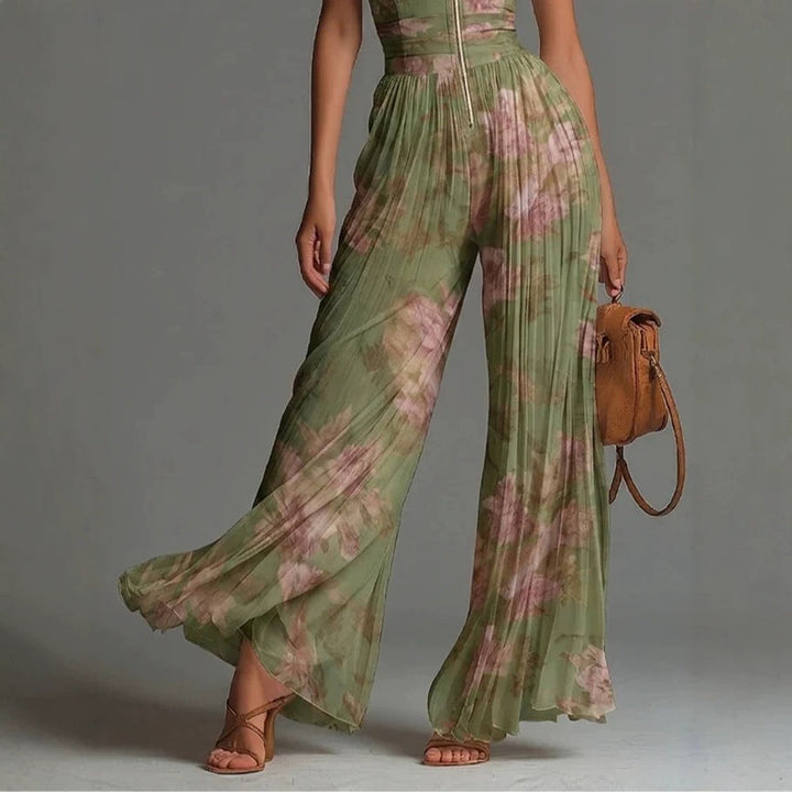 Elegante mono de fiesta plisado para mujer. Escote en V pronunciado y piernas anchas para eventos.