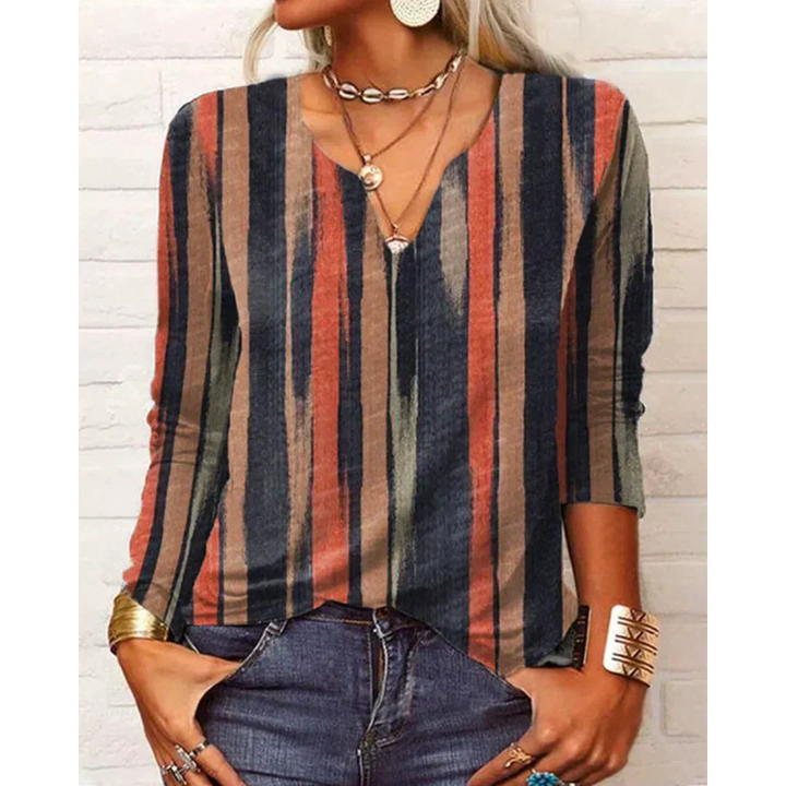 Imagen de blusa bohemia multicolor con estampado vibrante, escote V y mangas largas para moda femenina moderna.