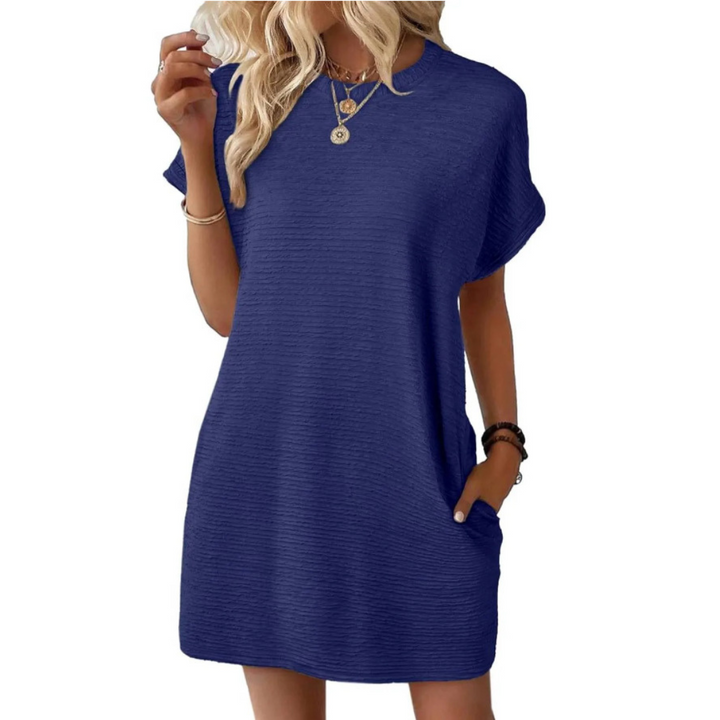 Vestido mini Sofía para mujer con bolsillos. Elegante y casual, ideal para llevar tus esenciales con estilo.