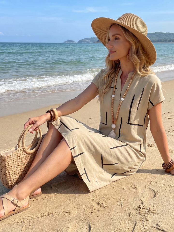Vestido midi de algodón lino fresco y transpirable, escote V, estampado geométrico. Confort casual de verano.
