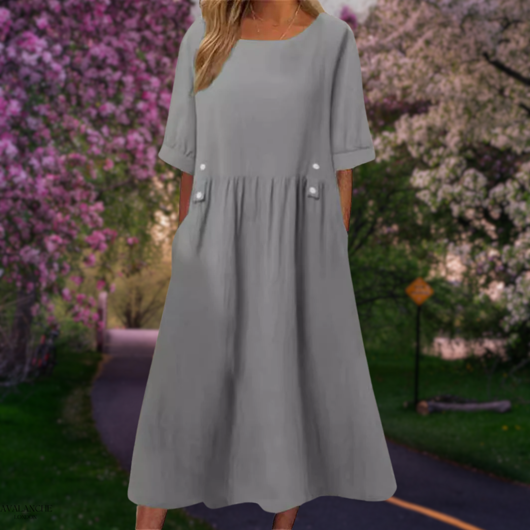 Vestido midi de verano para mujer, corte fluido y holgado, perfecto para días cálidos y playa.