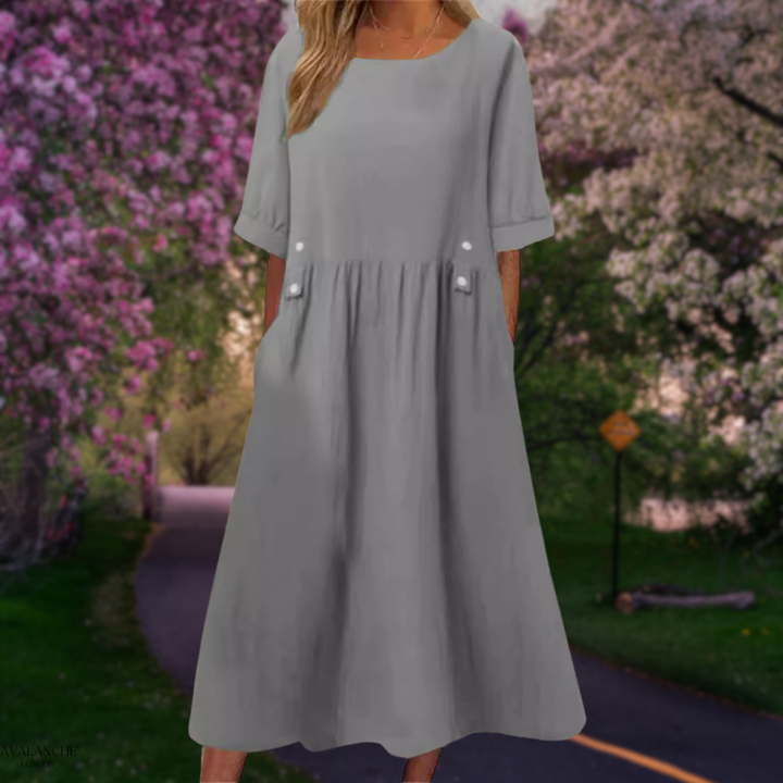 Vestido midi de verano para mujer, corte fluido y holgado, perfecto para días cálidos y playa.
