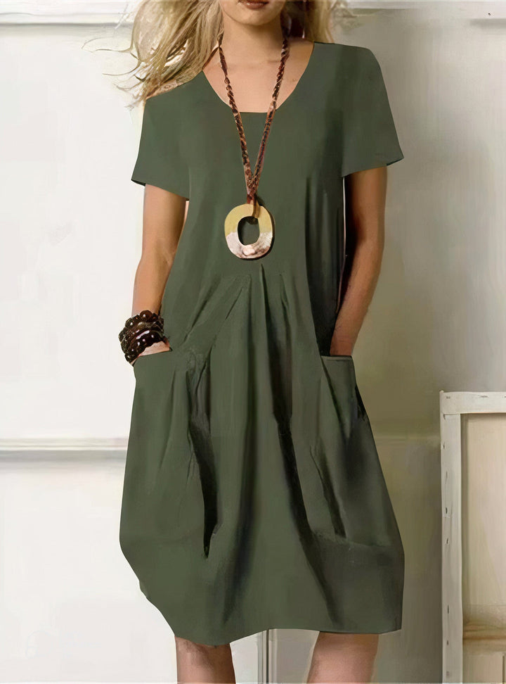 Vestido de mujer casual con manga corta, diseño relajado y corte recto. Ropa femenina cómoda para el día a día.