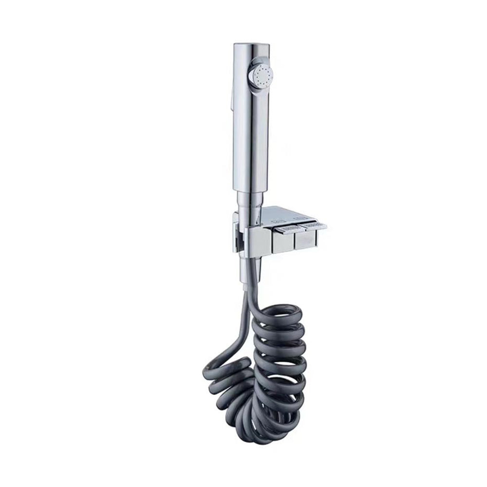 Bidé de pared gris con pulverizador de cobre/cromo, ajustable para máxima limpieza personal.