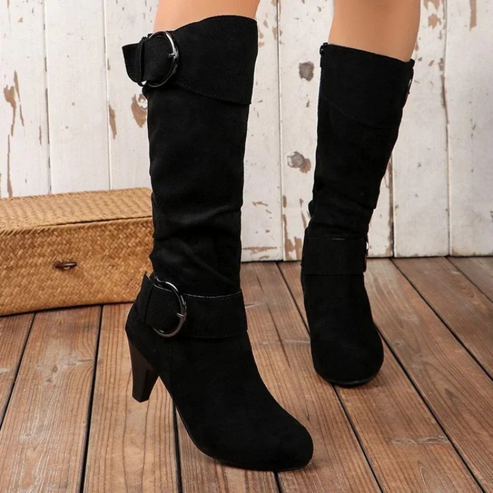 Elegantes botas altas de cuero para mujer con puntera redonda y diseño atemporal.