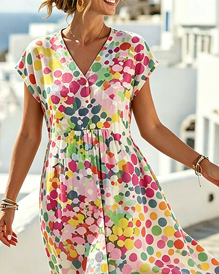 Vestido de mujer veraniego con patrón de lunares multicolor y cuello V. Prenda casual y cómoda para el día a día.
