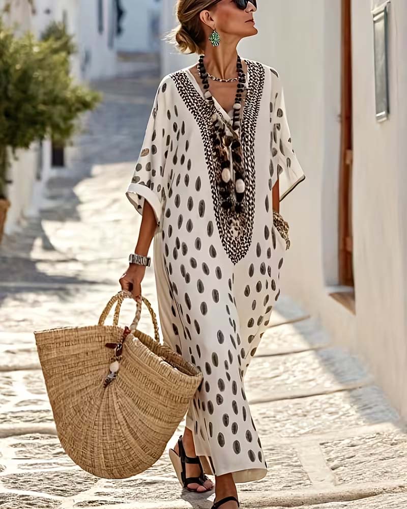 Maxi vestido kaftán de mujer con lunares, bordado étnico y cuello V. Ideal para verano, playa o look casual.