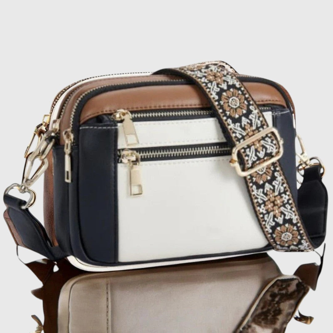Bolso de hombro elegante para mujer. Diseño moderno con correa floral, perfecto para cualquier ocasión.