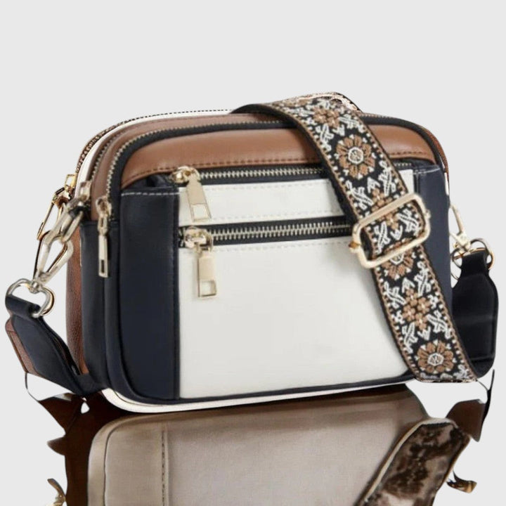 Bolso de hombro elegante para mujer. Diseño moderno con correa floral, perfecto para cualquier ocasión.