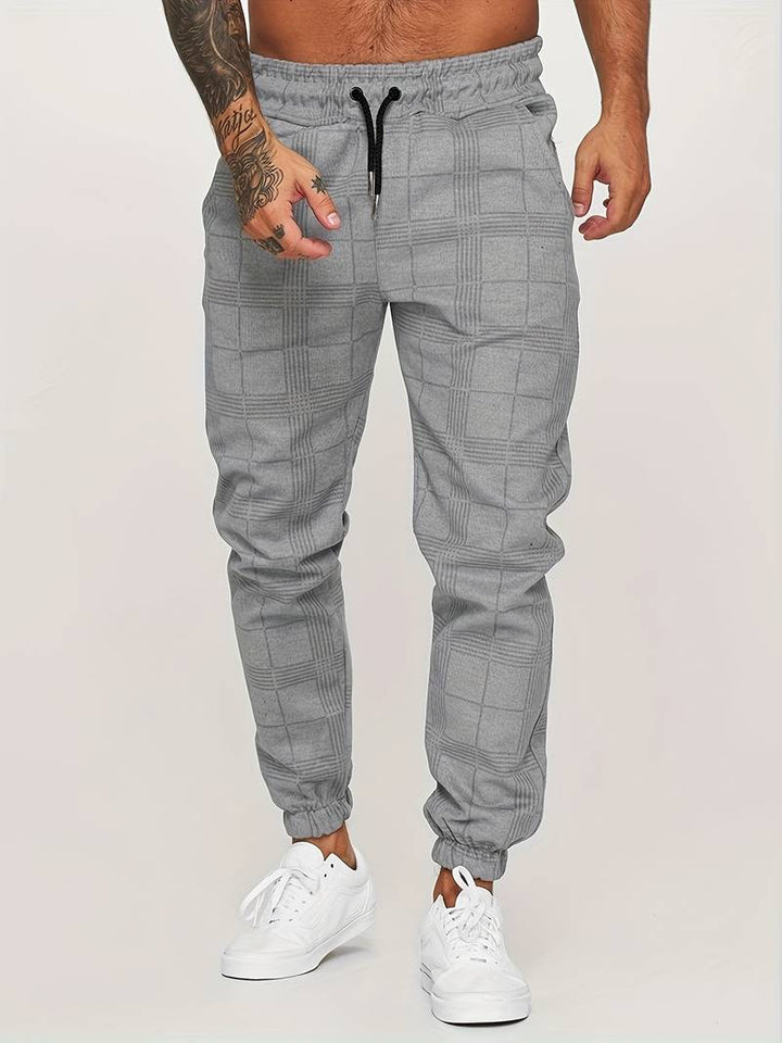 Tobillo de jogger masculino con puño elástico, asegurando comodidad y un estilo moderno deportivo.