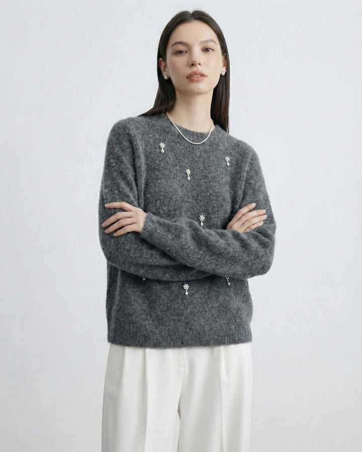 Elegante suéter gris para mujer, cuello redondo. Un básico versátil para tu guardarropa.