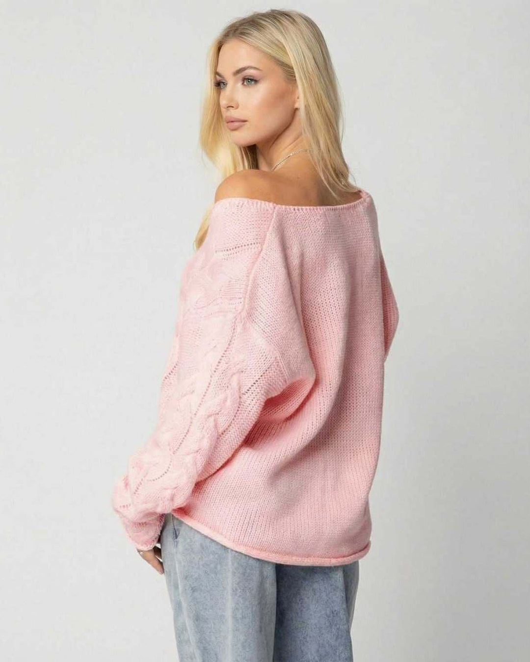 Suéter rosa de punto suave para mujer, cuello V, manga larga, confortable y elegante para climas fríos.
