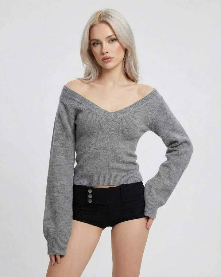 Suéter slim fit de cuello V para mujer. Manga larga y estilo moderno, perfecto para outfits casuales.