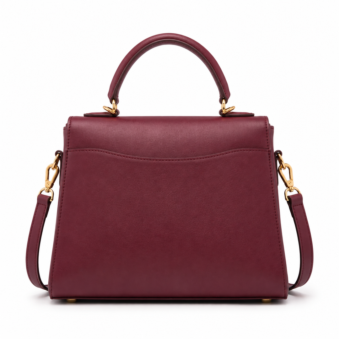 Bolso de mano burdeos mujer, diseño moderno en cuero sintético, cierre metálico. Complemento ideal para outfit.